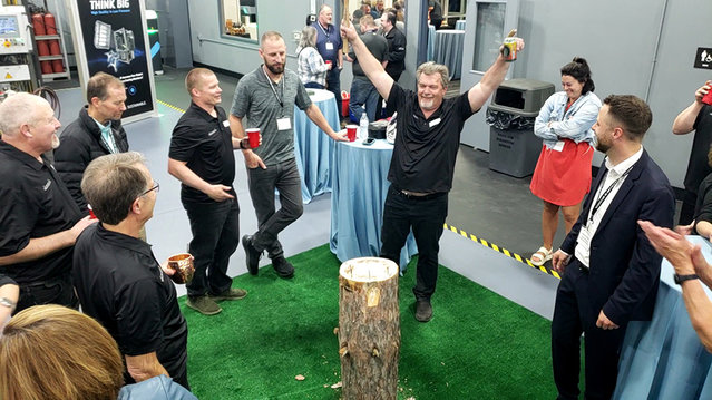 The tree trunk nail game from the Spessart region was very well received at the in-house eventThe tree trunk nail game from the Spessart region was very well received at the in-house event The tree trunk nail game from the Spessart region was very well received at the in-house event