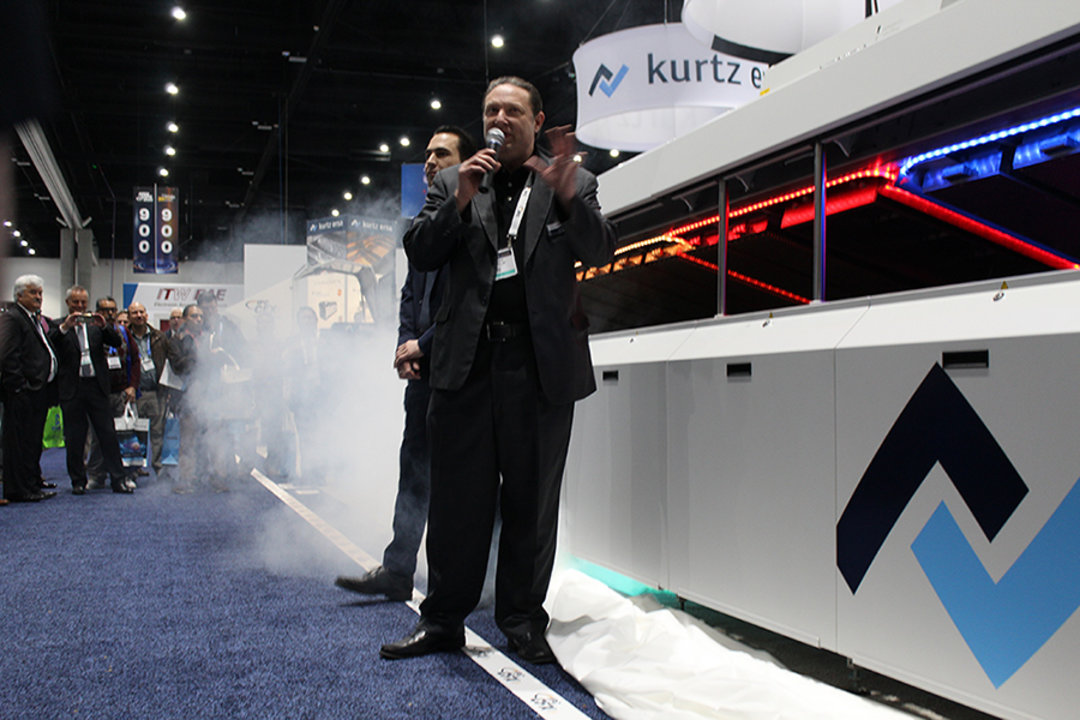 Ernie Grice, Vice President Sales at Kurtz Ersa, Inc., at the unveiling of the EXOS 10/26 reflow soldering machine at APEX 2020 Ernie Grice, Vice President Sales at Kurtz Ersa, Inc., at the unveiling of the EXOS 10/26 reflow soldering machine at APEX 2020