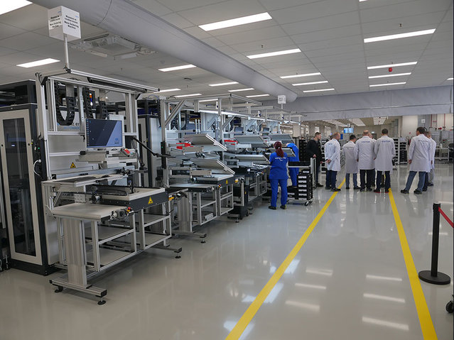 View of the three new automated placement stations, with another three placement stations on the opposite side View of the three new automated placement stations, with another three placement stations on the opposite side