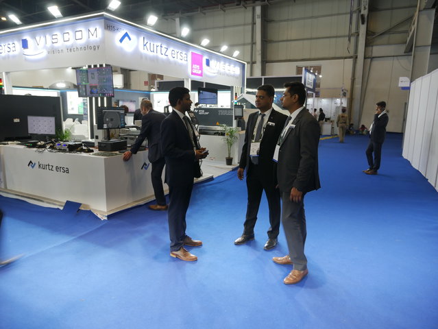 Trade show briefing with VPs Sameer Verma (Sales & Marketing, center), Gopa Gopinathen (Service & Processes, left), and Area Sales Manager Ankit Shukla