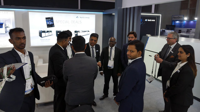 The trade show team getting ready before the show begins at the India Expo Centre