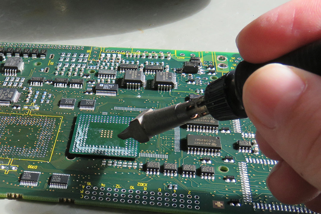 Pulling off the remaining solder with a soldering iron Pulling off the remaining solder with a soldering iron