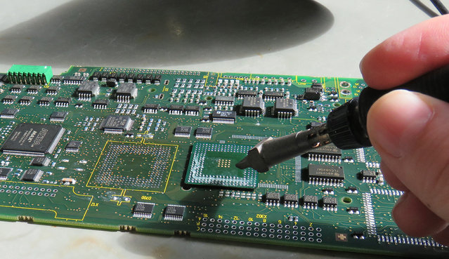 Removing the residual solder with a soldering iron