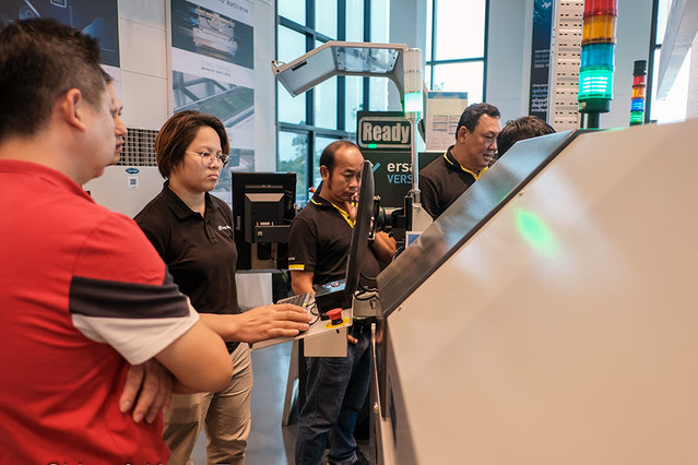 Ms. Ng Pei Ye (first female service technician) during training Ms. Ng Pei Ye (first female service technician) during training
