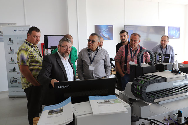 Ersa Area Sales Manager Frank Kappel (white shirt) explains how an Ersa rework system works at the Technology Day in Romania