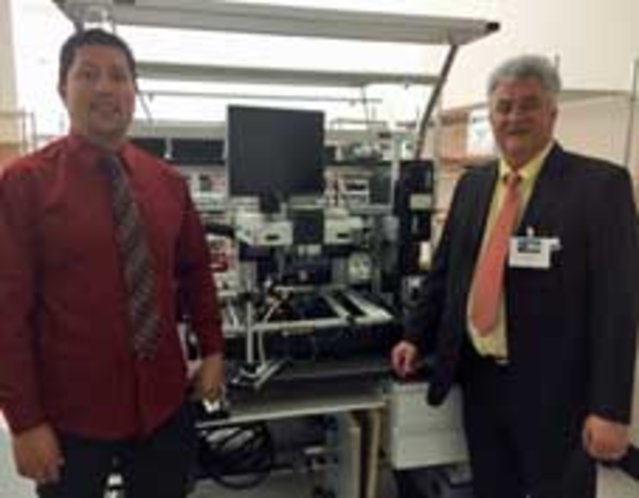 VadaTech SMT Production Manager Jay Motiwala (left) and Ersa Sales Manager Jean Verchere (right) in front of a HR 600 Rework System VadaTech SMT Production Manager Jay Motiwala (left) and Ersa Sales Manager Jean Verchere (right) in front of a HR 600 Rework System