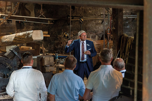 Ersa General Sales Manager Rainer Krauss lends a hand with the thrower hammer as a certified water guide 