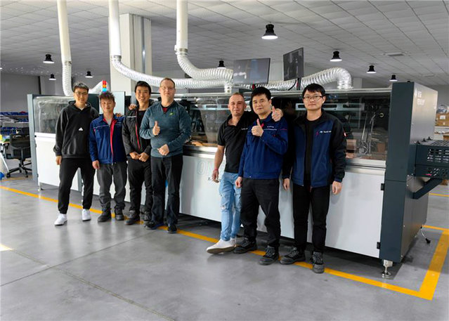 The German and local engineering teams in front of the first VERSAFLOW ONE machine manufactured in Zhuhai.